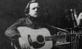 black-and-white photo of person playing guitar