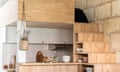 Mezzanine bed over kitchen in tiny open plan living space