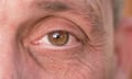 Closeup of a man's eye with short eyelashes