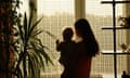 Mother with baby looking out the window