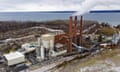 overhead view of a mining facility by the water