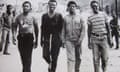 Four men walking