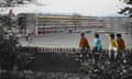 The illustration highlights four boys sitting on a school fence looking away. Original image from Alamy.