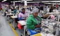 Garment workers in a factory at sewing machines