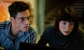 Rami Malek as Heller and Caitriona Balfe as Inquiline in 20th Century Studios' THE AMATEUR